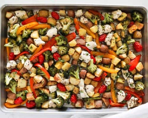 chicken and vegetables cooked on a sheet pan