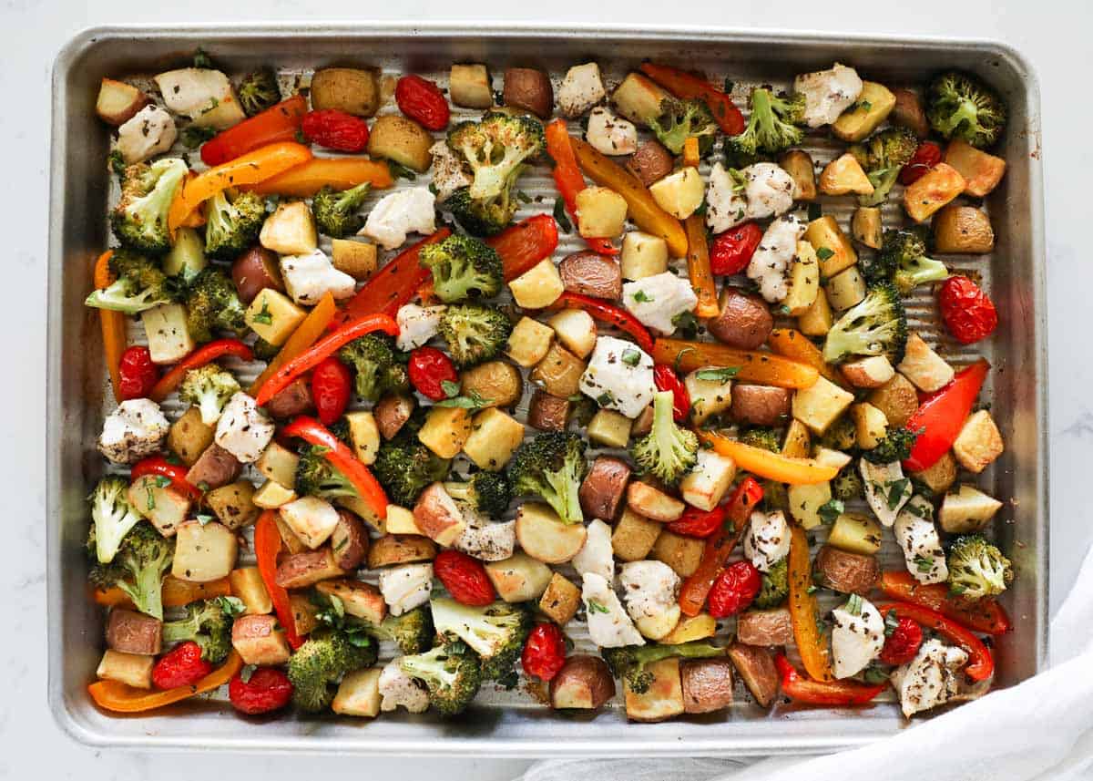 chicken and vegetables cooked on a sheet pan