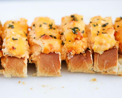 sliced stuffed french bread with cheese