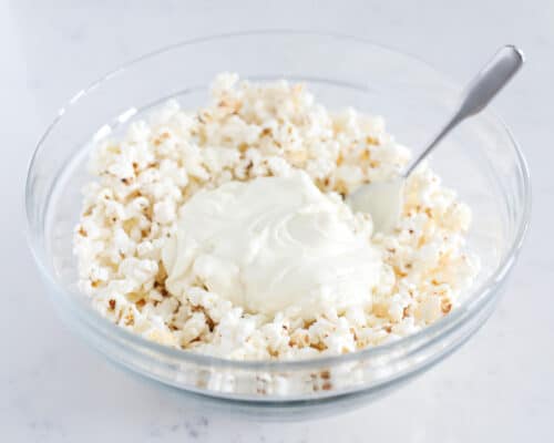 white chocolate and popcorn in glass bowl