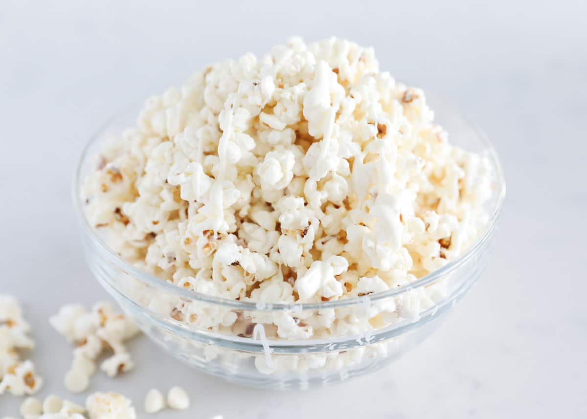 A bowl of white chocolate popcorn.