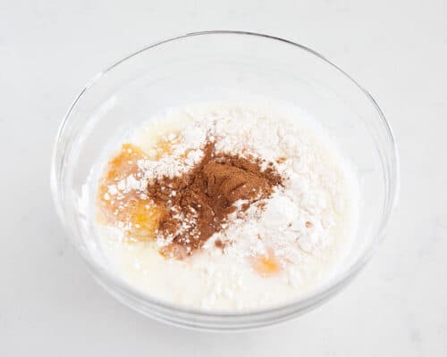 flour and milk in bowl with cinnamon