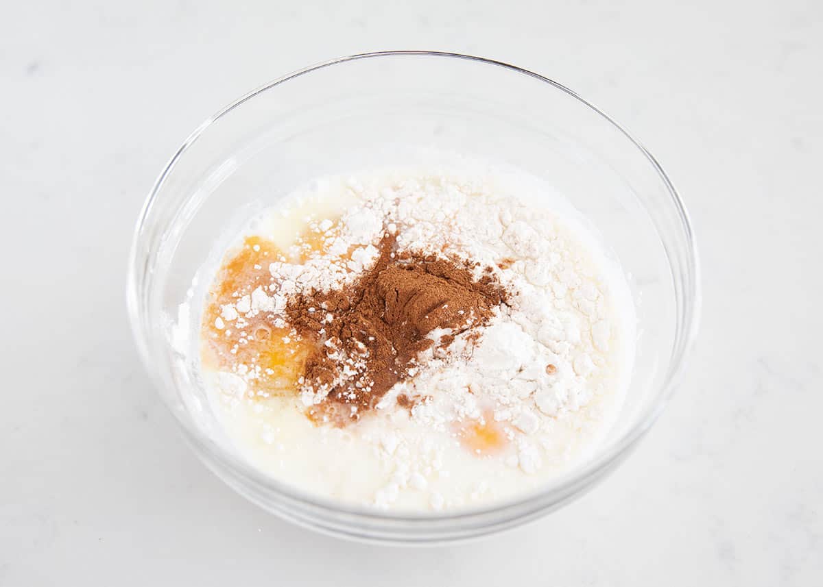 flour and milk in bowl with cinnamon
