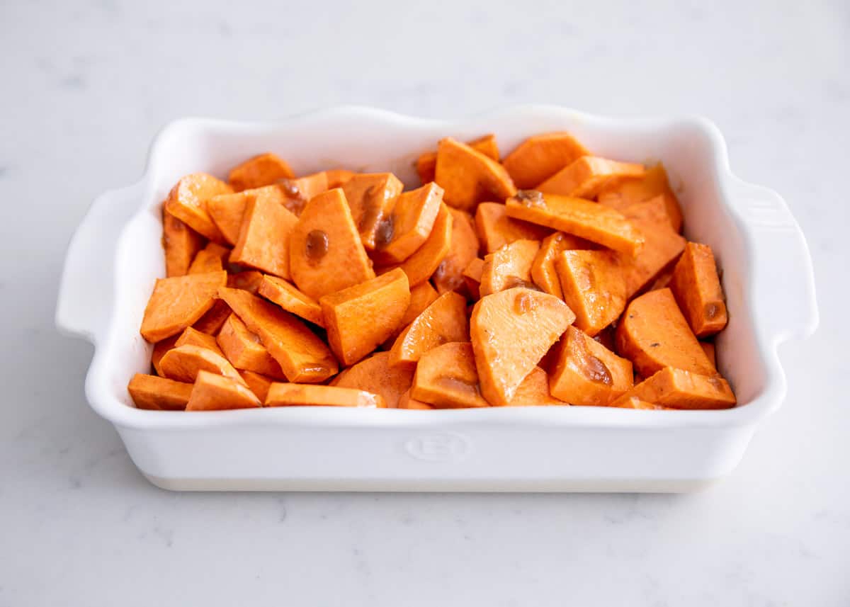 Candied yams in white dish.