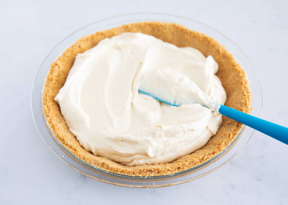 spreading eggnog pie into crust