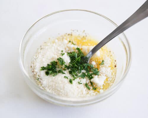 mixing butter and parmesan in bowl