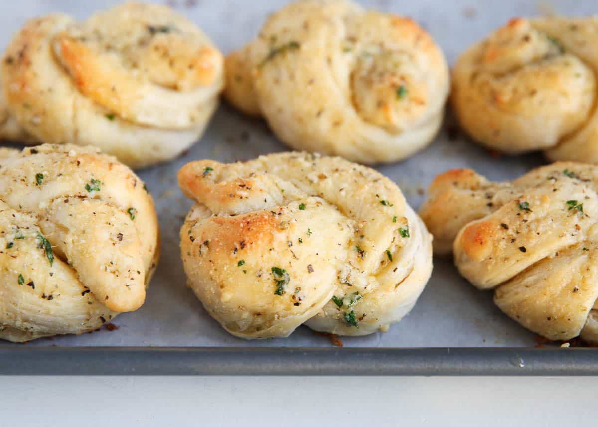 garlic knots on baking sheet