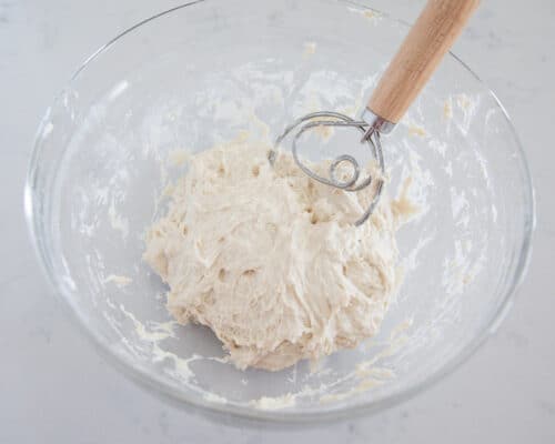 mixing dough in glass bowl