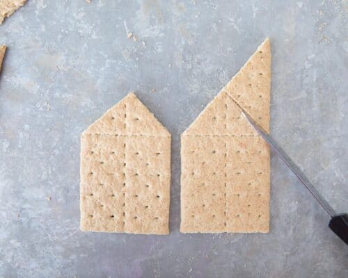 cutting graham crackers on pan