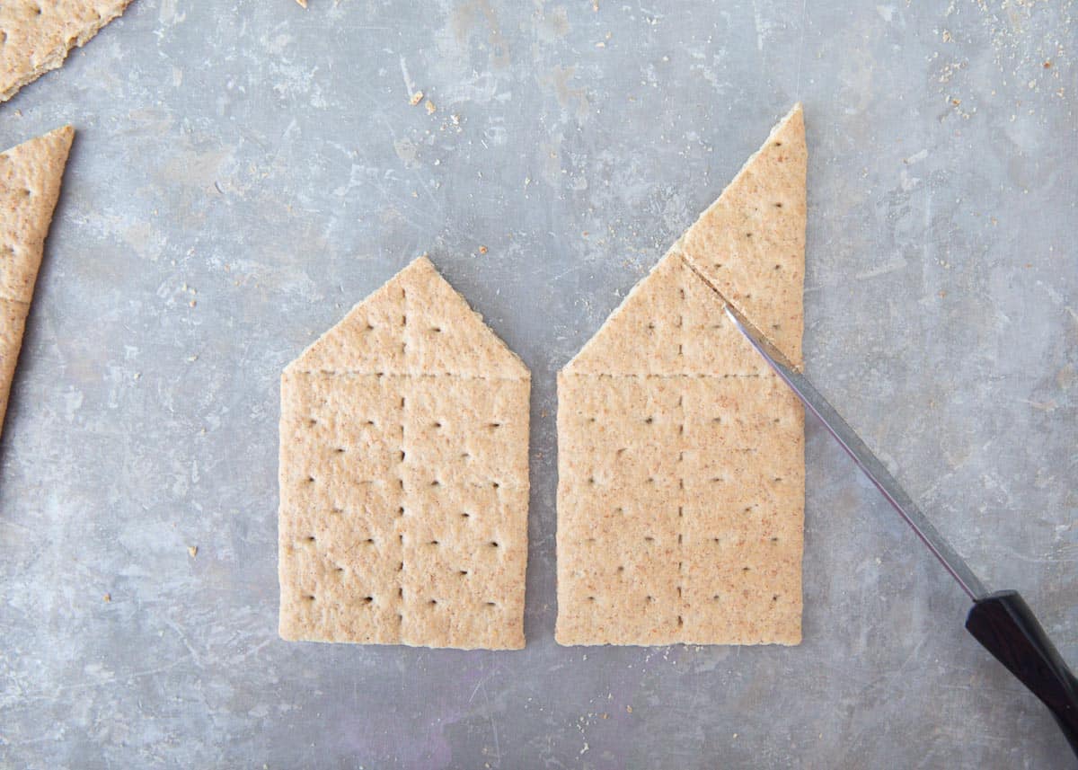 cutting graham crackers on pan