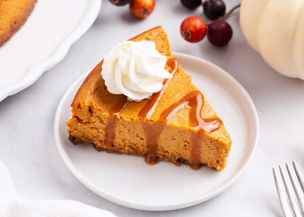 slice of pumpkin cheesecake on white plate