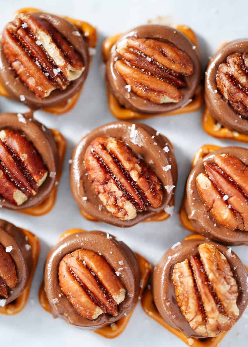 Sweet and salty Rolo pretzel turtles made with only 3 ingredients in less than 15 minutes! This quick and easy dessert is the perfect no-fuss treat to enjoy this Christmas. rolo pretzel turtles on counter