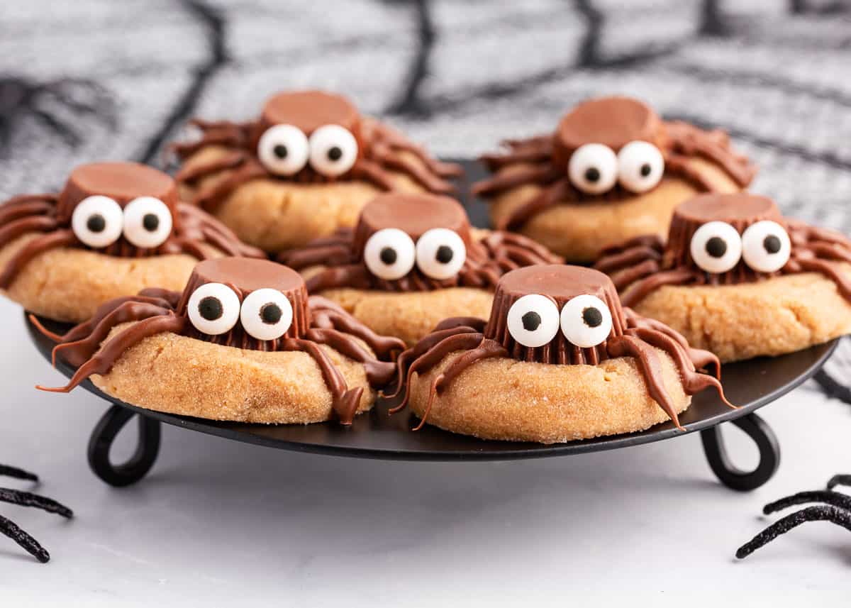 spider cookies on black plate