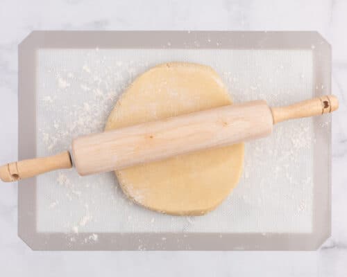 rolling out sugar cookie dough