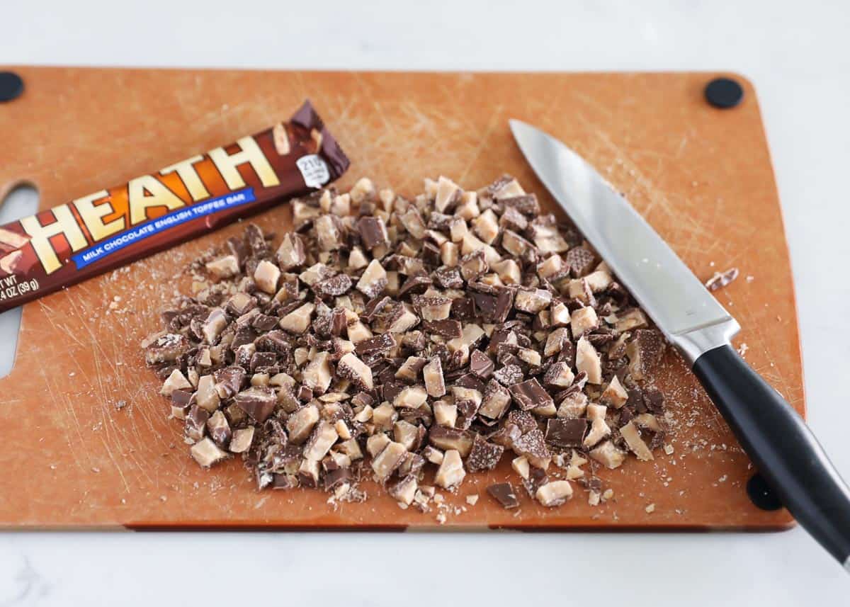 Chopping Heath bars on cutting board.