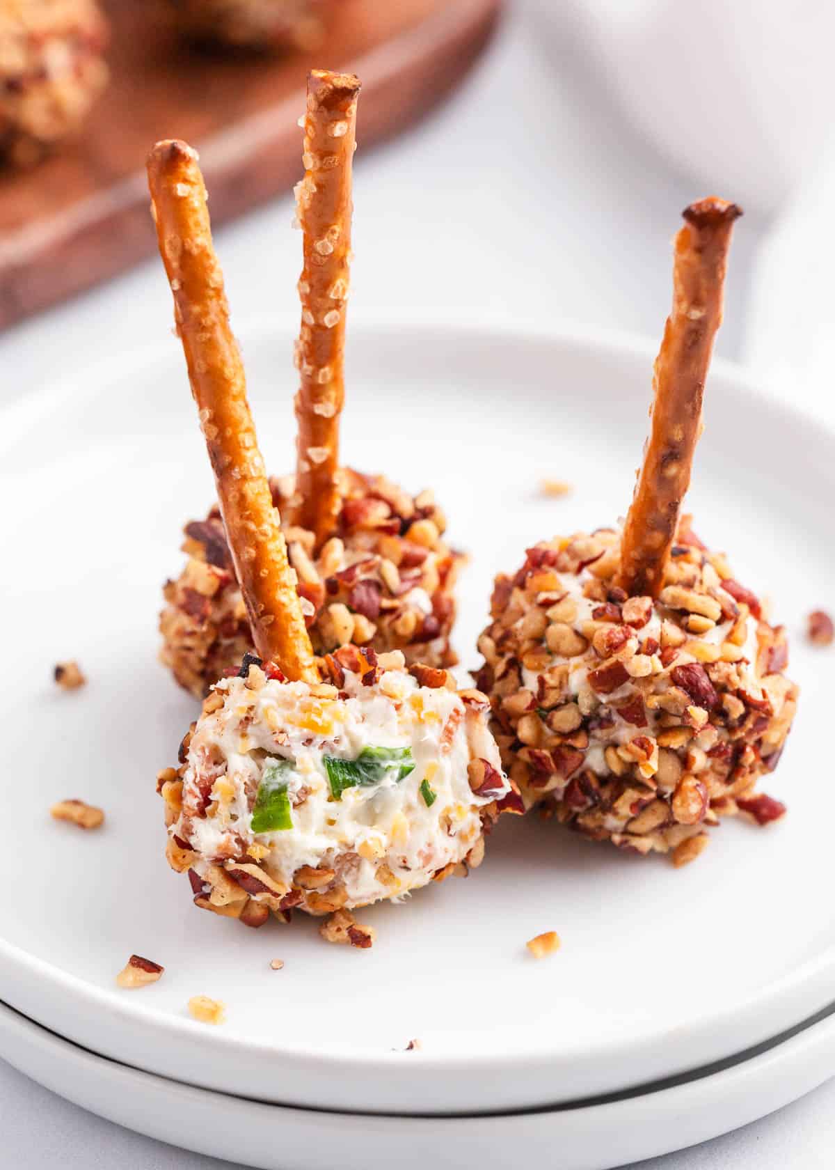 cheese ball bites on white plates