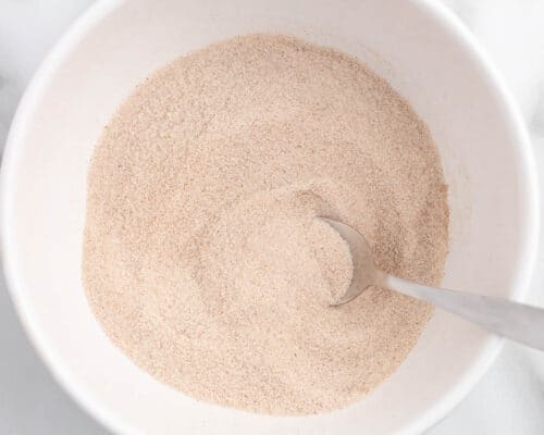 mixing cinnamon sugar in bowl