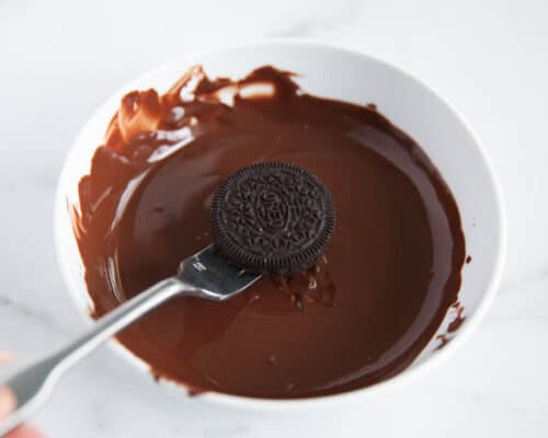 dipping oreo in chocolate