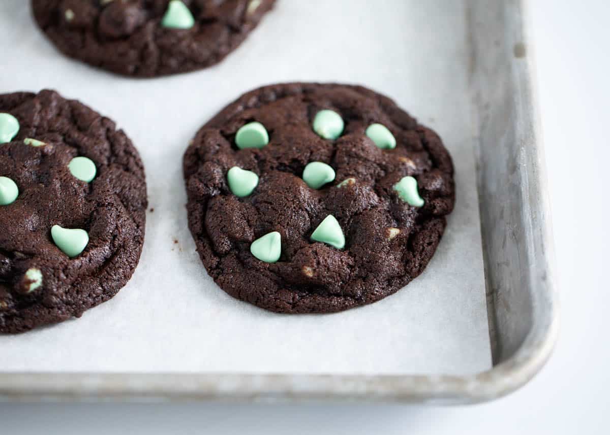 chocolate cookies with mint chips on pan