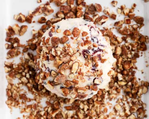 rolling cheese ball in pecans
