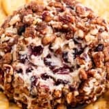 cranberry cheese ball with pecans and crackers