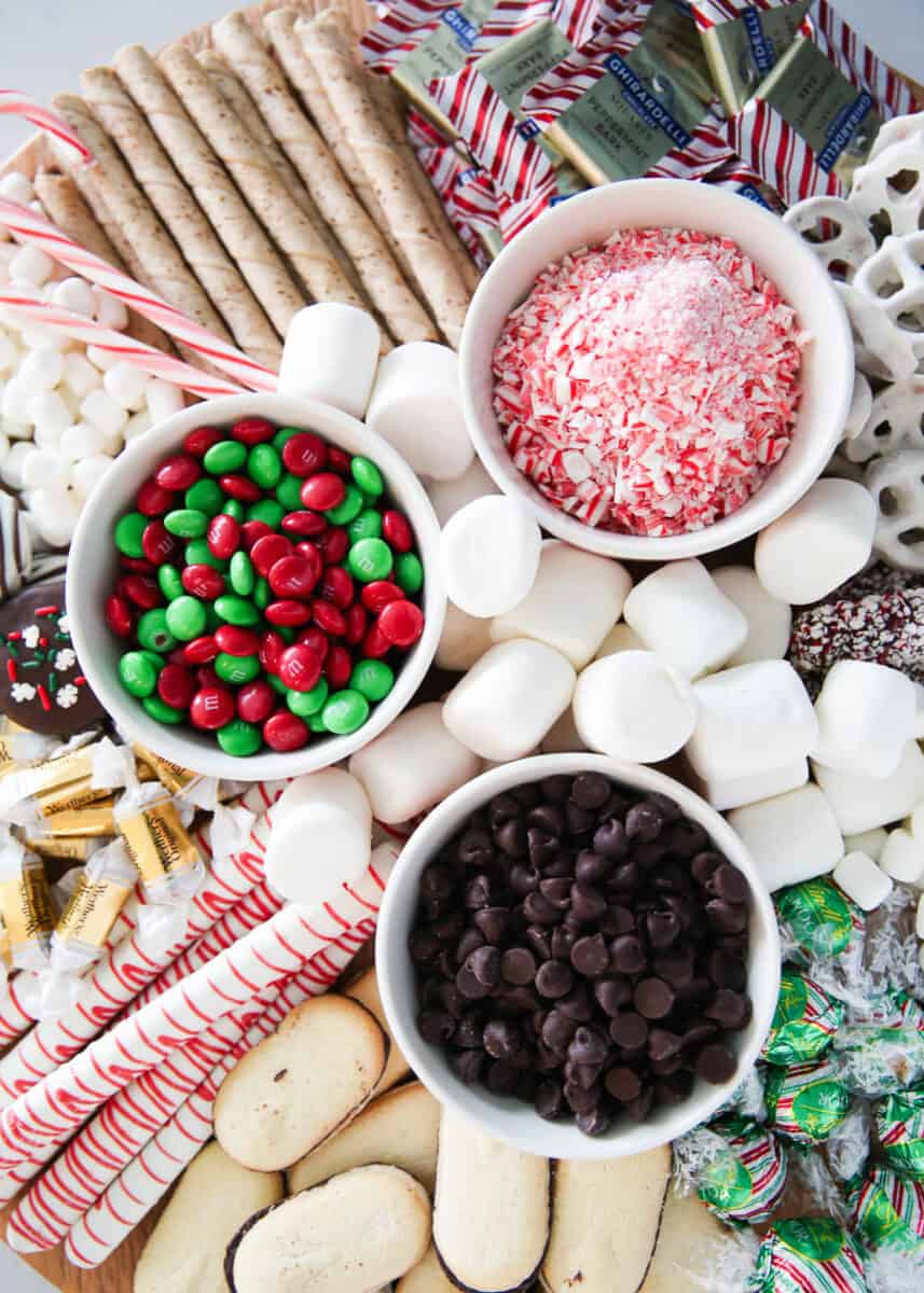hot chocolate charcuterie board with bowls of candy