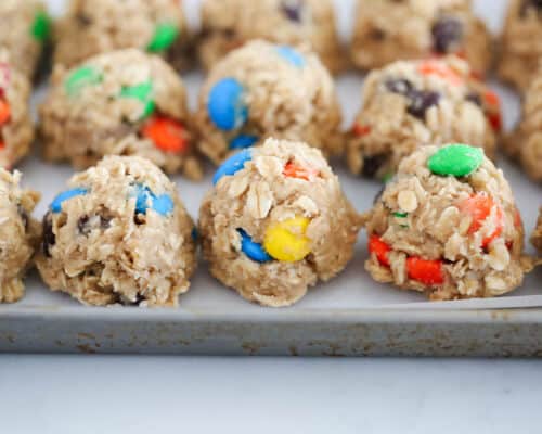 cookie dough balls on baking sheet