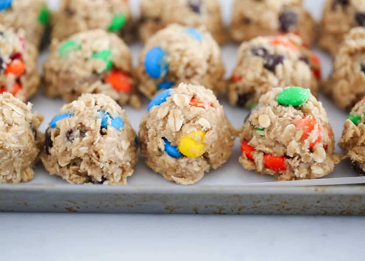 cookie dough balls on baking sheet