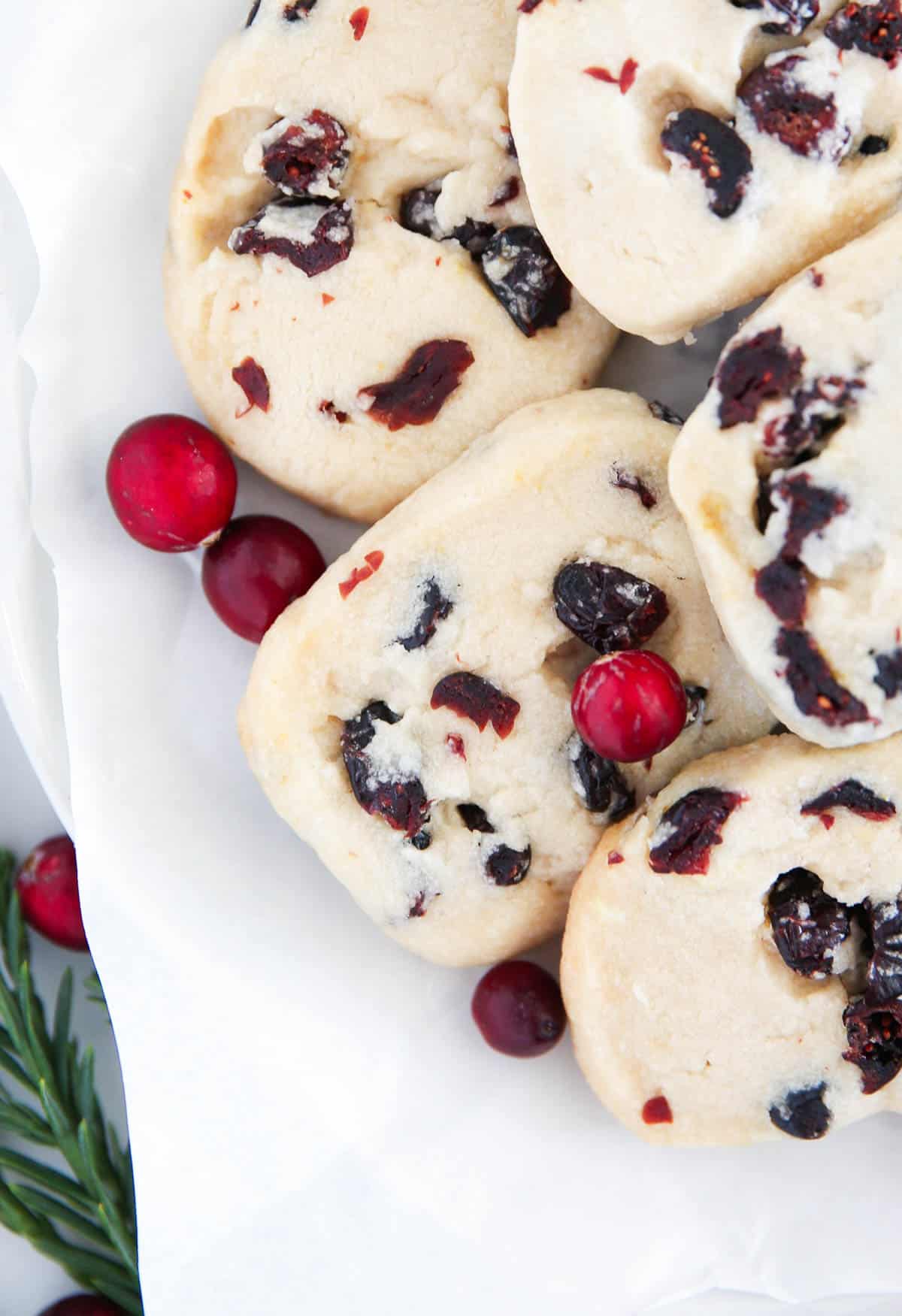 Cranberry orange shortbread cookies on plate.