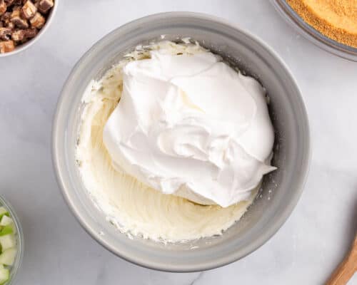 cream cheese and cool whip in bowl