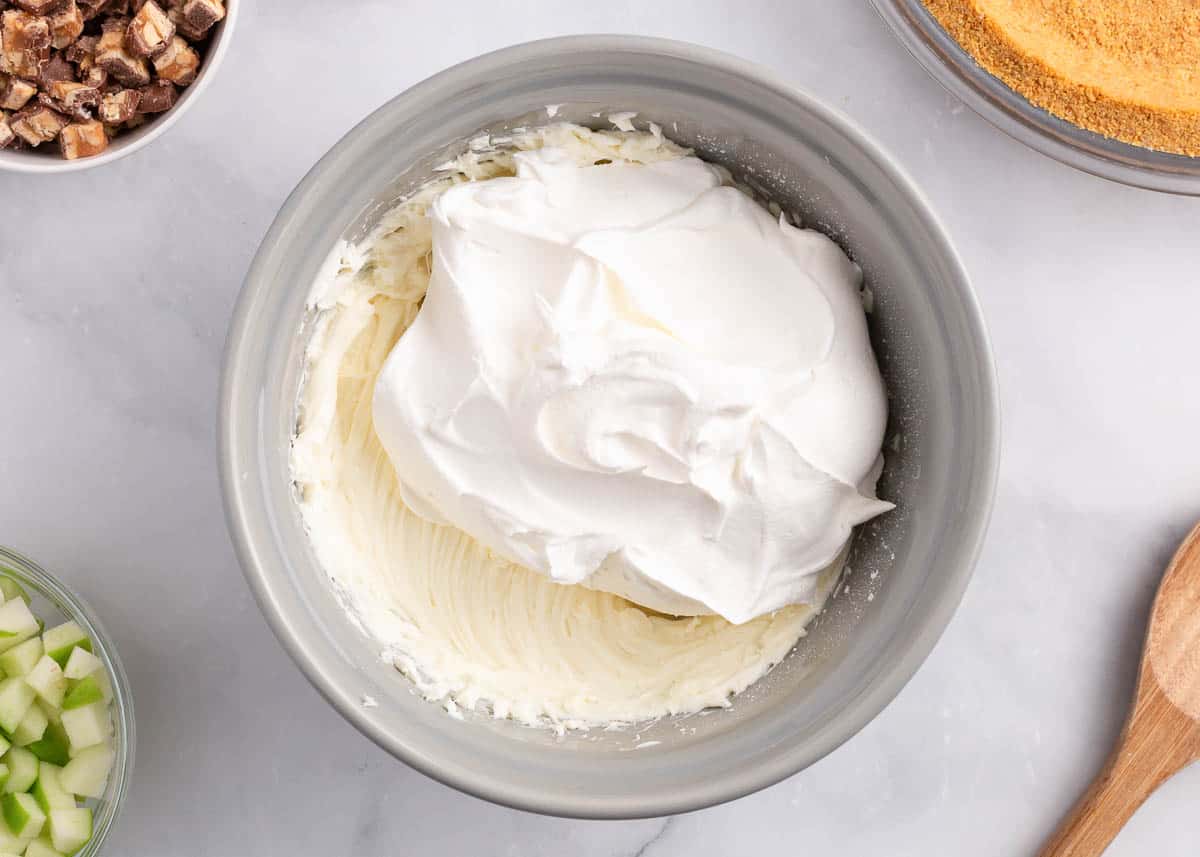Whipped cream cheese in a bowl with Cool Whip.
