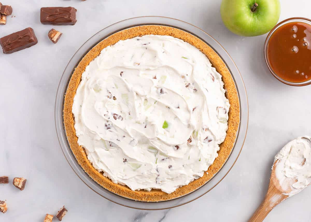 Cream mixture inside of graham cracker crust.