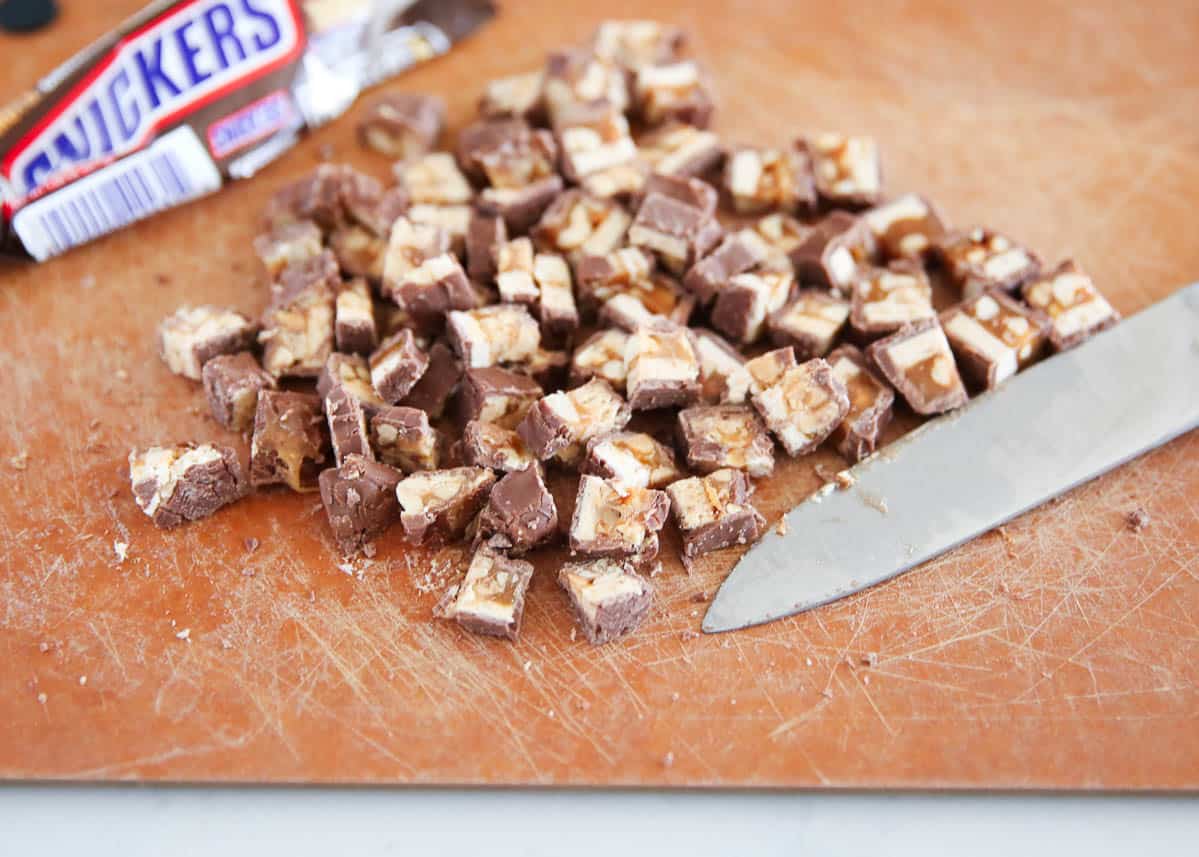 chopped snickers on cutting board