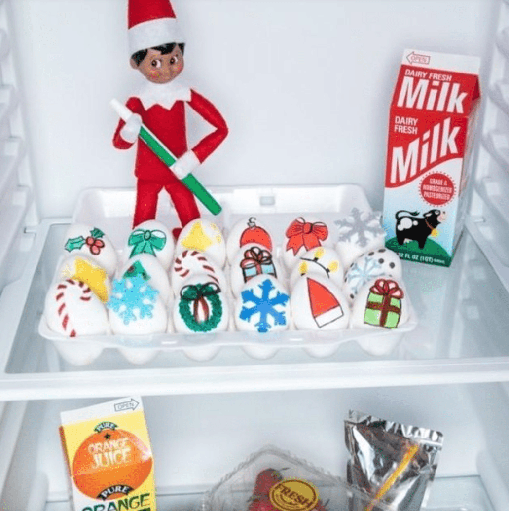 Elf in the fridge with eggs and milk.
