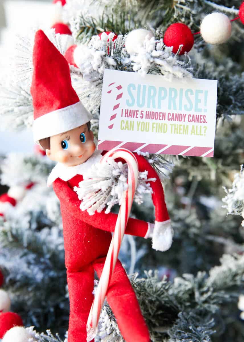 Elf on the shelf ideas showing an Elf with candy cane.