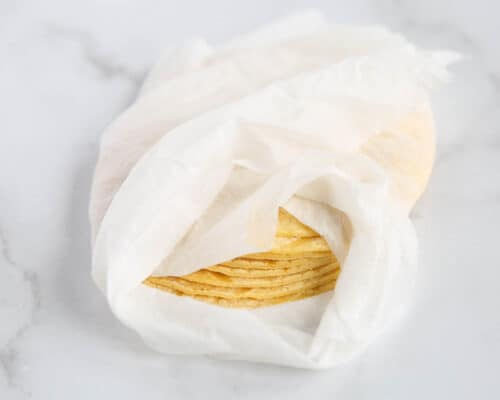 tortillas wrapped in paper towels