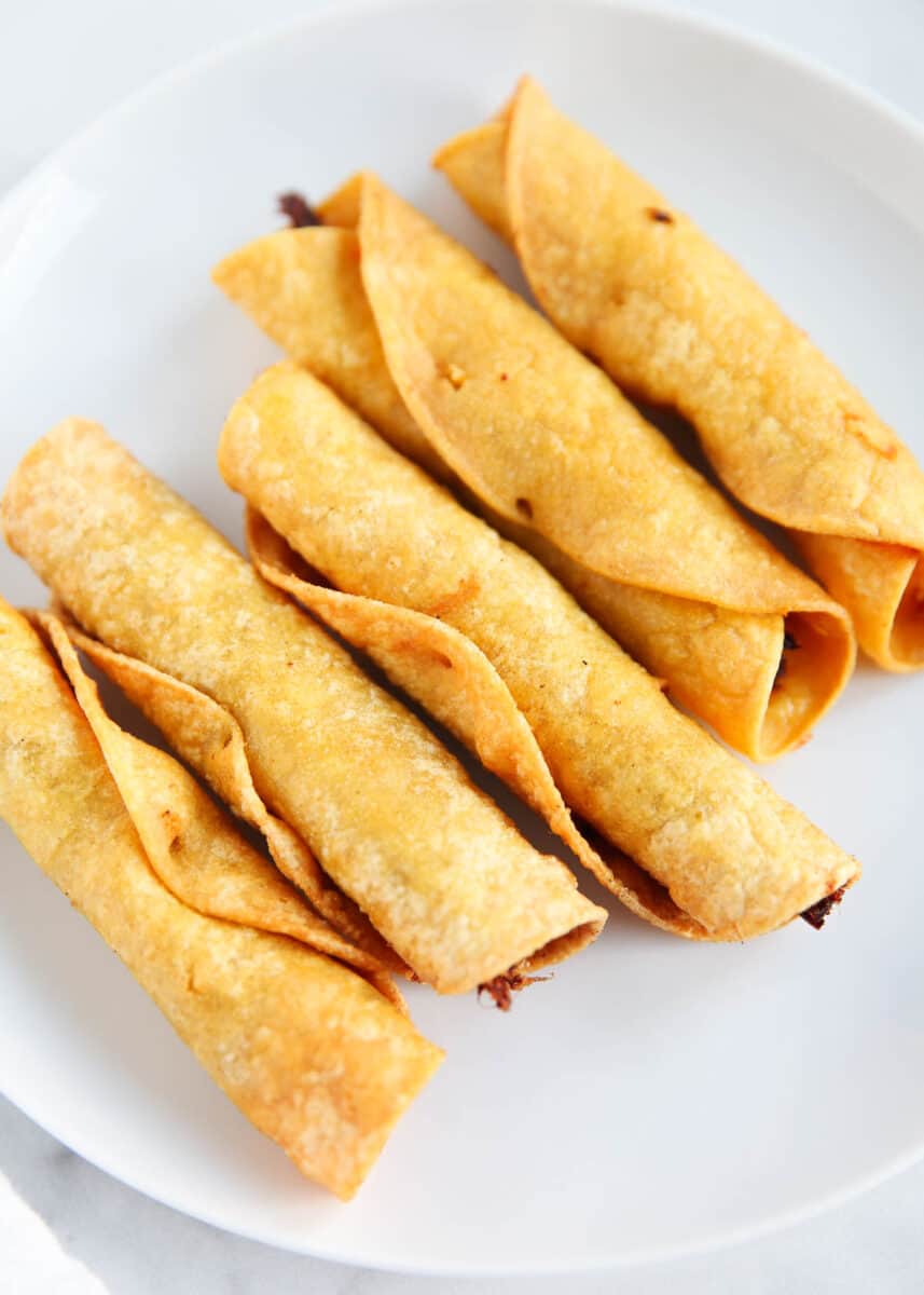 beef taquitos on white plate