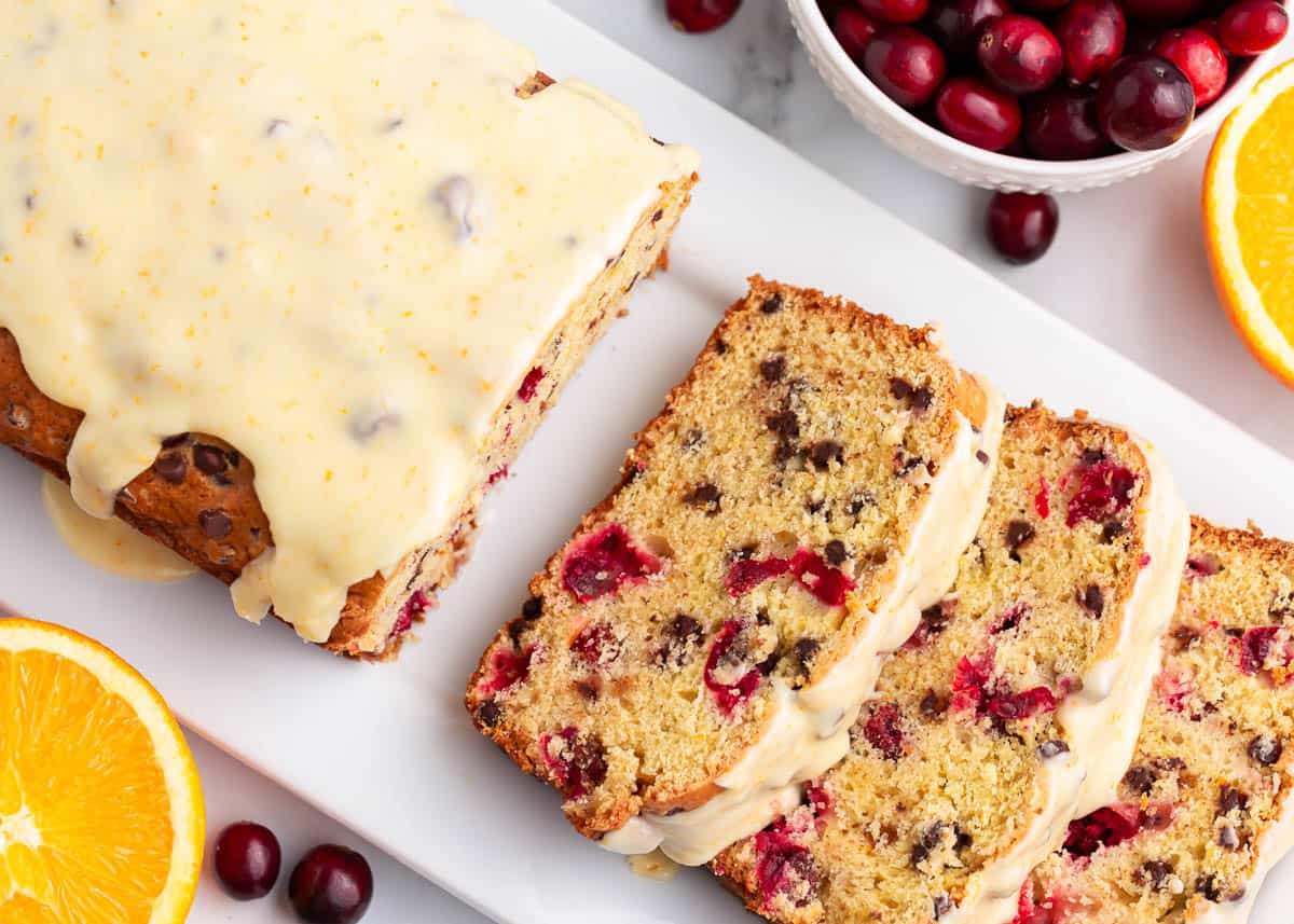 Sliced cranberry orange bread on a plate.