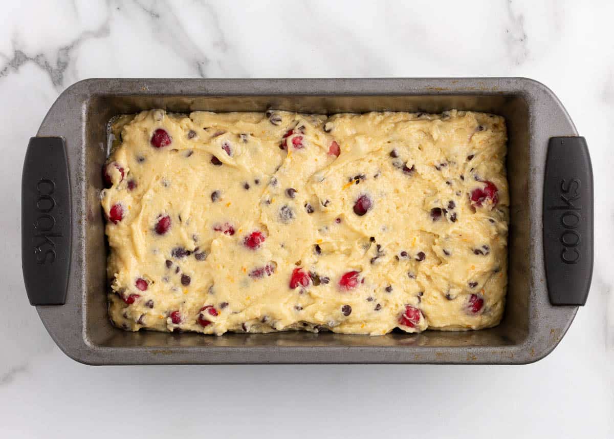 cranberry orange bread batter in pan