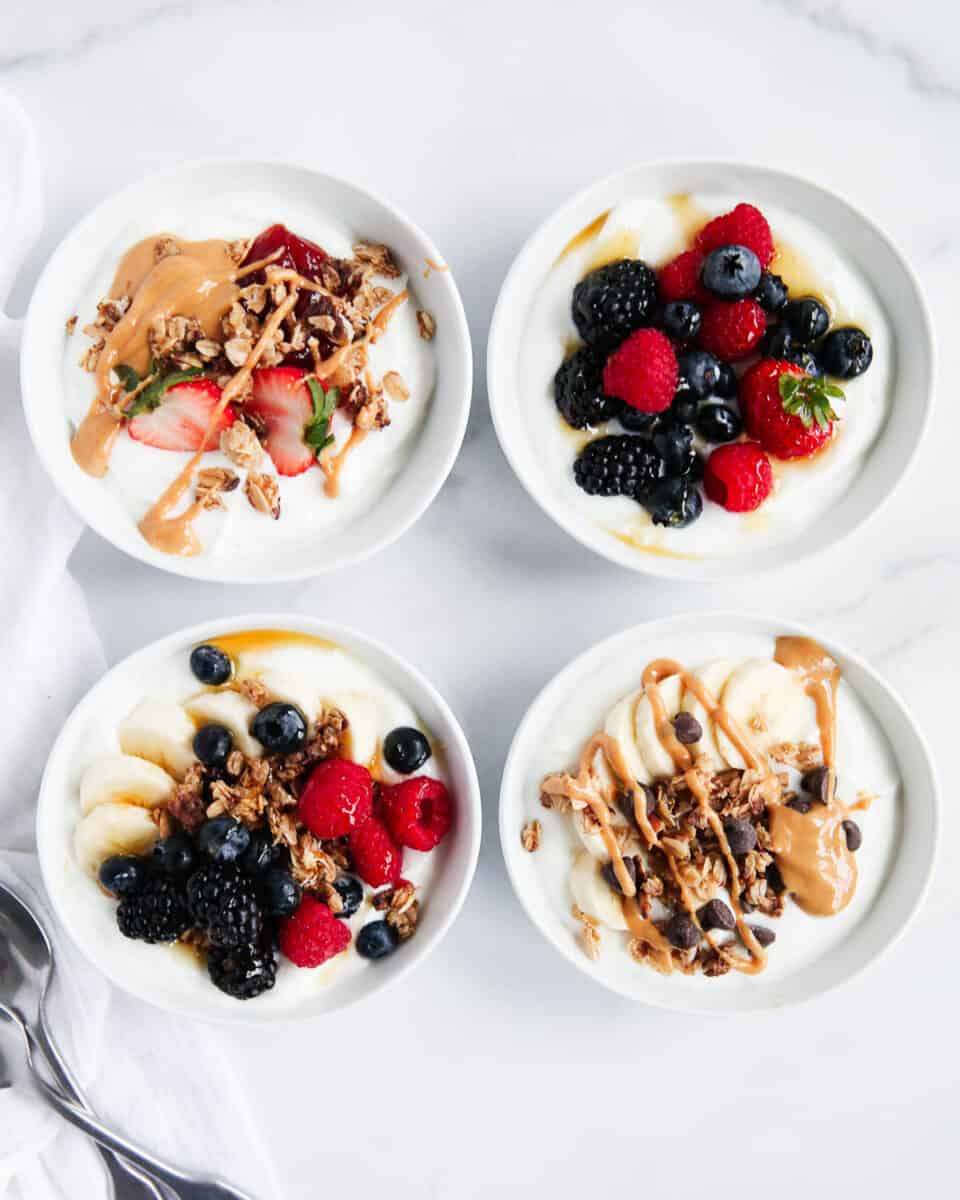 homemade yogurt bowls on marble counter