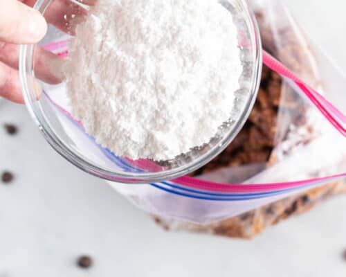 pouring powdered sugar in bag