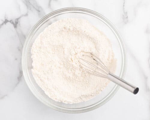 whisking flour in bowl