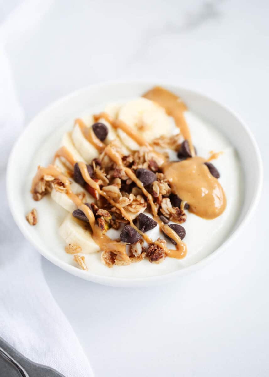 peanut butter and granola on top of yogurt