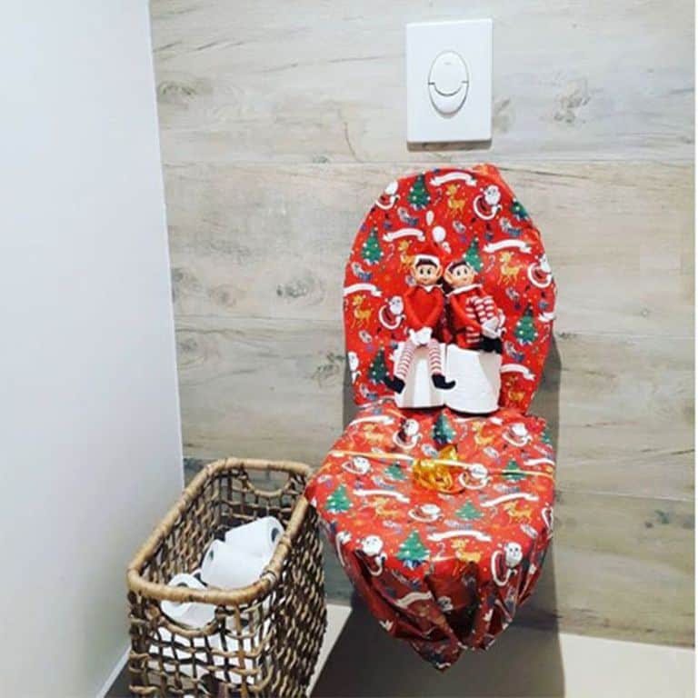 Elf on the Shelf wrapped toilet.