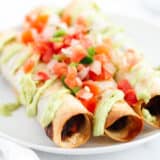 black bean taquitos on white plate