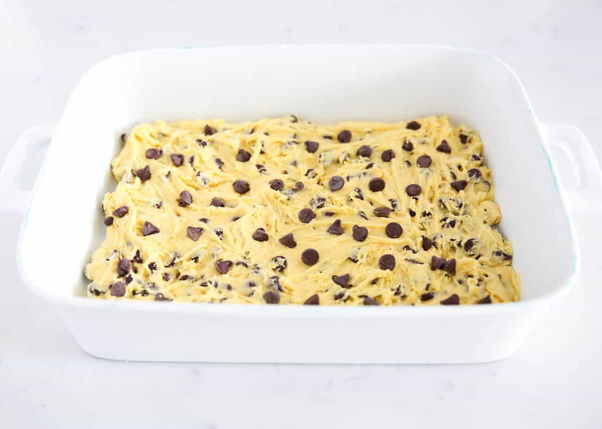 chocolate chip cookie dough pressed into white dish