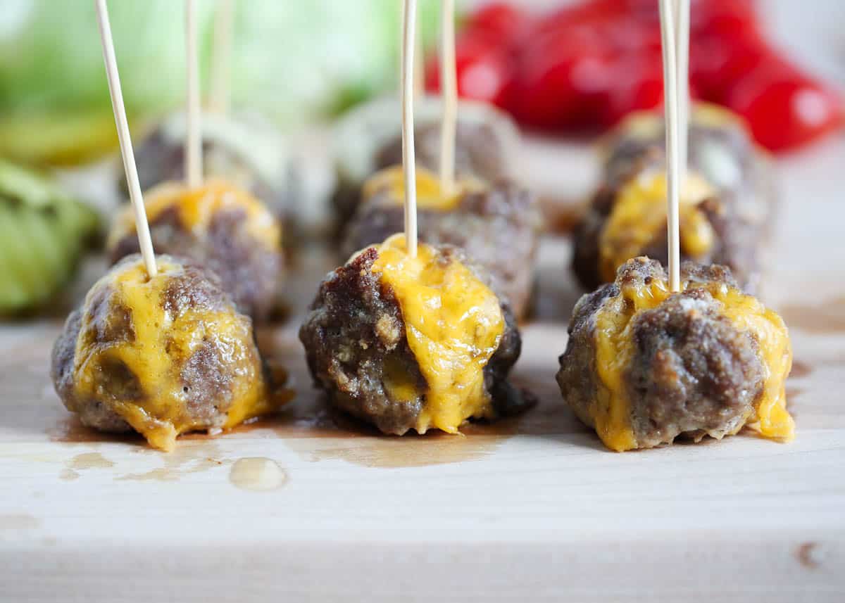 cheeseburger meatballs on wooden board