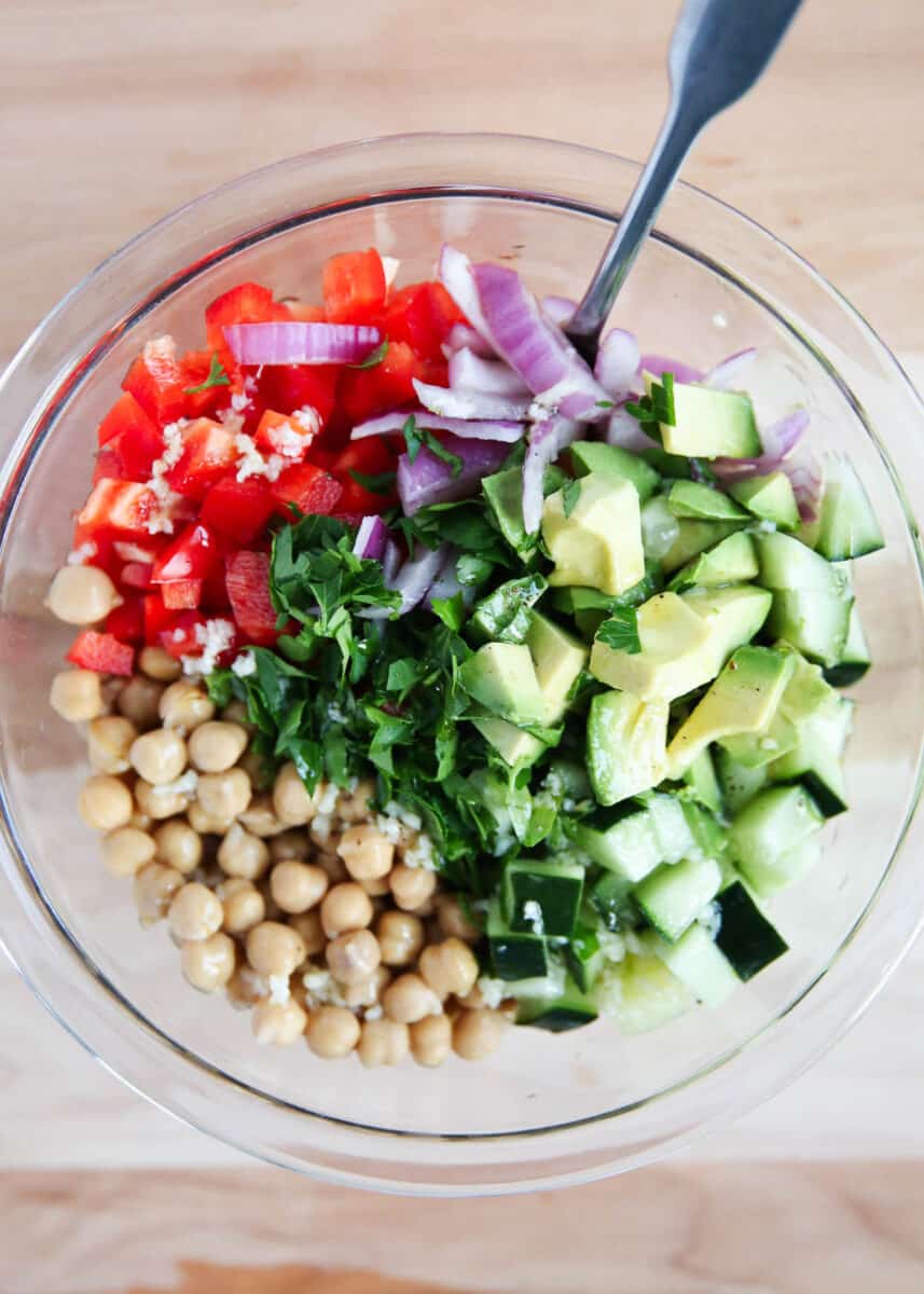 vegetables and chick peas in glass bowl
