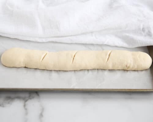 french baguette dough on baking sheet