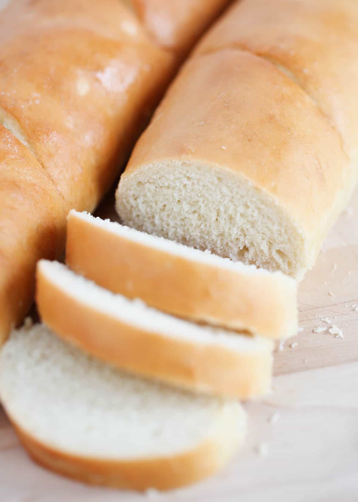 This easy French baguette recipe is a delicious loaf of bread with a golden crust and a soft yet sturdy crumb. There is nothing better than having a basket of crusty homemade bread on your dinner table, except maybe knowing you made it yourself!This easy French baguette recipe is a delicious loaf of bread with a golden crust and a soft yet sturdy crumb. There is nothing better than having a basket of crusty bread on your dinner table, except maybe knowing you made it yourself! sliced french baguette